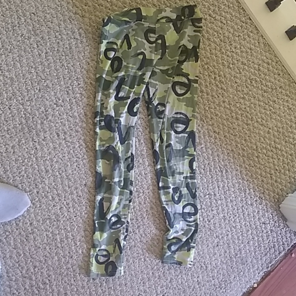 A army leggings with the word love all over it